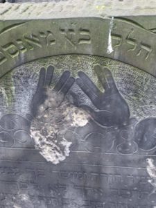 Image of Headstone iconography of a Cohen mitzavah headstone Cohen priestly blessing hands arrangement