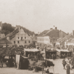 Image of Sale of clothing at the market in Krazimierz nad Wisła (Yiddish: Kuzmir), ca. 1920.