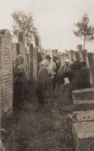 Image of Professional Mourners (klogerins) in the cemetery in Brody.
