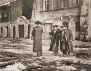 Image of Hasidim outside a house of prayer on Saturday. Cracow, 1938.