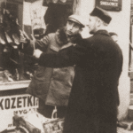 Image of Buying flags for children to carry in the Torah procession on the eve of Simhat Tora