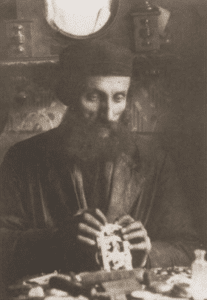 Image of Naftole Grinband, a clockmaker. Gora Kalwaria (Yiddish: Ger), 1928.