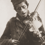 Image of Zisl, the street musician. Staszow, 1930s.