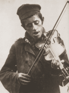 Image of Zisl, the street musician. Staszow, 1930s.