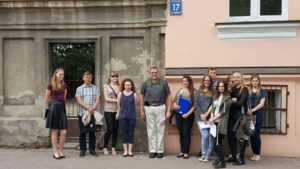 Image of Irv in front of his dad's apartment building with Kalisz Students of Dialog