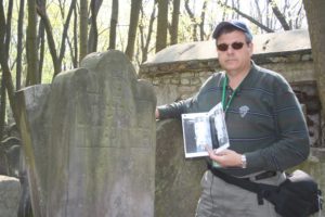 Image of Irv next to his Great Grandfather’s graves.